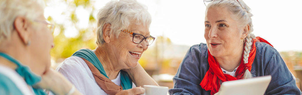 Residents sit together and talk in a shared space at a community like Cornerstone Assisted Living in Plymouth MN.