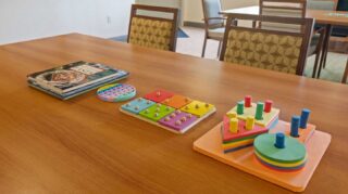 Table with puzzles, books, and activity supplies for residents at Cornerstone Assisted Living in Plymouth MN.