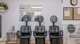 On-site beauty salon with styling chairs and mirrors at Cornerstone Assisted Living in Plymouth MN.
