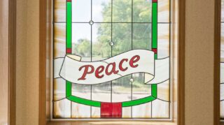 Stained glass window with decorative design in the chapel at Cornerstone Assisted Living in Plymouth MN.